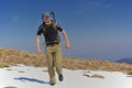 Hiker in a snowfield in the mountains