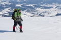 Hiker snowshoeing in winter mountains during sunny day Royalty Free Stock Photo