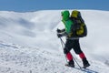 Hiker snowshoeing in winter mountains during sunny day Royalty Free Stock Photo