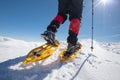 Hiker snowshoeing in winter mountains during sunny day Royalty Free Stock Photo