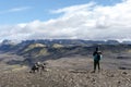 Hiker standing and admiring nature in Iceland. Backpacker enjoying the view of Icelandic landscape Royalty Free Stock Photo