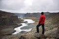 Hiker standing at the edge of a Valley in Vatnajokull National Park in Iceland