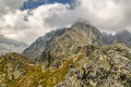 Hiker standing on the hill and looking on mountains