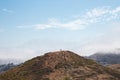 Hiker standing on the peak of a hill in Twin Peaks, San Francisco Royalty Free Stock Photo