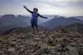 Hiker stands on Avalanche Peak Summit