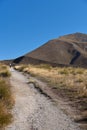 Hiker On A Path At Lindis Pass New Zealand Royalty Free Stock Photo