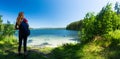 Hiker stands on the green coast