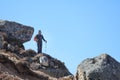 Hiker stands on the mountainside in Himalayas