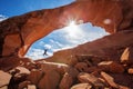 Hiker stay below Skyline arch in Arches National Park in Utah, USA Royalty Free Stock Photo