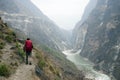 Hiker on Steep Mountain Path