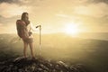 Hiker with stick on mountain