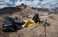 Hiker takes a brake on a trail in Grand Canyon National Park, Ar