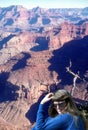 A Hiker Takes a Break on the South Rim of the Grand Canyon