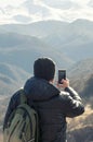 Hiker takes photo of beautiful mountains North Caucasus, Europe