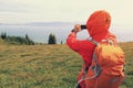 hiker taking photo with smart phone at mountain peak Royalty Free Stock Photo