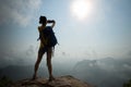 Hiker taking photo in the sunrise mountain top Royalty Free Stock Photo