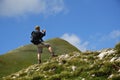 Hiker taking photos on mountain