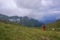 Hiker taking pictures in the mountains