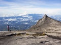 Hiker at the top of Mount Kinabalu in Sabah, Malaysia