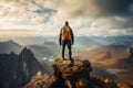 Hiker on the top of the mountain looking at the beautiful landscape sunset Royalty Free Stock Photo