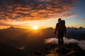 Hiker on the top of the mountain looking at the beautiful landscape sunset Royalty Free Stock Photo