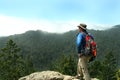 Hiker on Top of a Peak Royalty Free Stock Photo