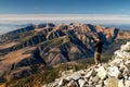 Hiker at top of the peak making picture of beautiful mountain landscape in Slovakia Royalty Free Stock Photo