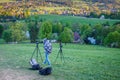 Hiker tourist professional photography shooting on tripod in mountains