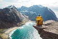 Hiker tourist yellow backpack on rock in mountain, panoramic landscape, traveler relax holiday concept, view planning wayroad in Royalty Free Stock Photo