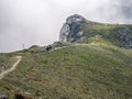 Hiker on a trail in Bucegi Mountains on their way to Omu peak Royalty Free Stock Photo