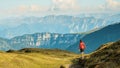 Hiker on the trail in the Swiss mountains. Lifetime experience