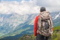 Hiker traveling in Alps. Alpine peaks landskape background. Jungfrau, Bernese highland. Sport, tourism and hiking