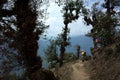 Hiker trekking in mountains in scary forest on trail between Jiri and Lukla, Lower part of Everest trek