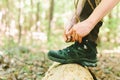 Hiker tying boot laces on a log Royalty Free Stock Photo