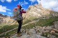 Hiker use smartphone in mountain top rock Royalty Free Stock Photo