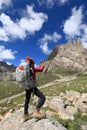 hiker use smartphone in mountain top rock Royalty Free Stock Photo