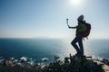 Hiker using action camera mounted on selfiestick