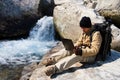 Hiker using a laptop outdoors