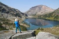 Hiker with Video Camera Above Ring Lake Royalty Free Stock Photo