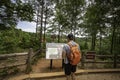 Hiker views trail map at Providence Canyon