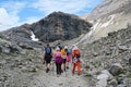 hiker walking along a path at Grossglockner Mountain and Pasterze in Austria. Summer. Royalty Free Stock Photo