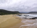 Hiker walking on Nature`s Valley Beach on Garden Route, South Africa Royalty Free Stock Photo