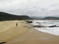 Hiker walking on Nature`s Valley Beach on Garden Route, South Africa Royalty Free Stock Photo