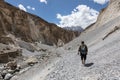 Hiker walking in dry canyon Royalty Free Stock Photo