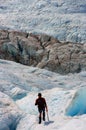 A Hiker walking on ice in the Franz Josef glacier at the southern island of New Zealand