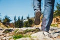 Hiker walking on path in the mountains Royalty Free Stock Photo