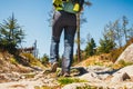 Hiker walking on path in the mountains Royalty Free Stock Photo