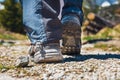 Hiker walking on path in the mountains Royalty Free Stock Photo