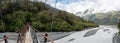 A hiker walking the Roberts Point Track, Franz Josef Glacier National Park Royalty Free Stock Photo