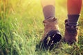 Hiker walking on trail in grassland Royalty Free Stock Photo